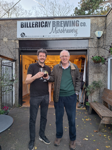 The photograph shows John with Alex Watson at the Brewery. 